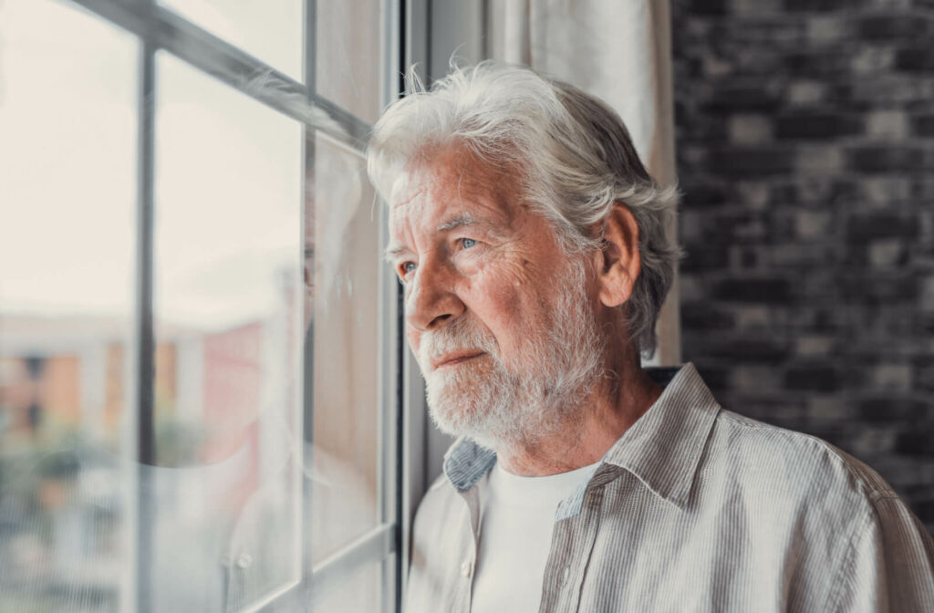 a man hoping to leave assisted living looks out a window